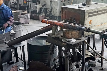 steel bar is heated pushed out of over for further forging process